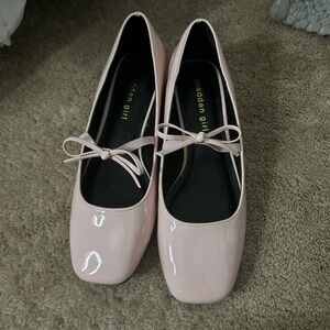pink fancy shoes with a cute bow strap. brand new originally 49 dollars